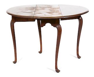 A Queen Anne Style Mahogany Oval Drop Leaf Table Height 27 3/4 x width 37 1/4 inches.
