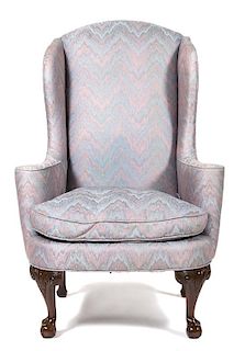 A Chippendale Style Mahogany Upholstered Wing Chair Height 46 inches.