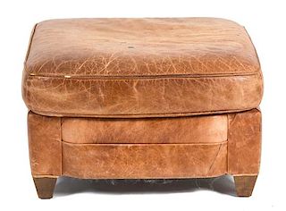 A Contemporary Brown Leather Ottoman Height 17 x width 27 x depth 25 inches.