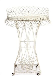 A Victorian Wirework Plant Stand Height 33 x width 23 x depth 14 inches.