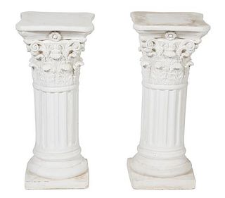 A Pair of Cast Stone Corinthian Capital Column Form Pedestals Height 29 x width 13 x depth 13 inches.
