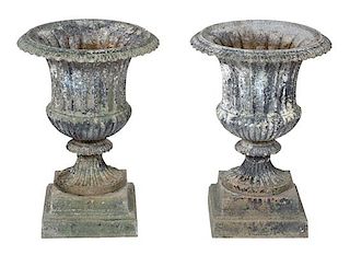 A Pair of Patinated Metal Campana Form Urns Height 24 x diameter 16 1/2 inches.