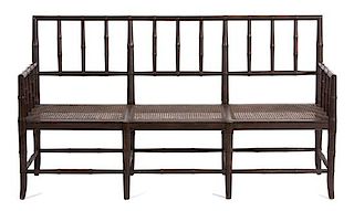 A Bamboo Carved and Painted Wood Settee Height 37 1/2 x width 67 1/2 x depth 21 3/4 inches.