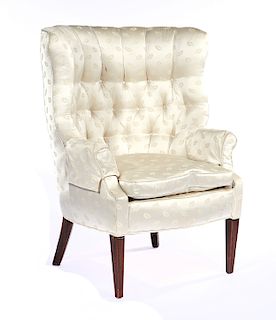 Chippendale wingback armchair with tufted upholstery