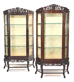 Pair of Chinese carved wood and glass display cabinets