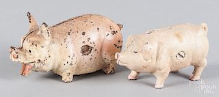 Two painted cast iron pig still banks