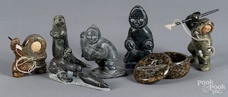 Six Inuit carved stone figures