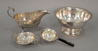 Four piece sterling silver lot to include gravy boat (lg. 7 1/4in.), small bowl, and two tea strainers. 14.9 total troy ounces.