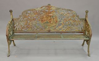 Large Victorian style iron bench having greek medallion back, bird and branch arms. lg. 72 1/2in.