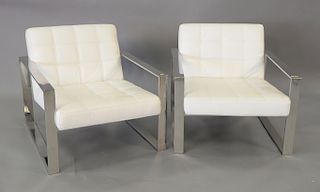 Pair of modern white leather armchairs with chrome arms and supports. ht. 27in., wd. 30in.