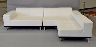 Contemporary white leather sectional sofa having three parts and chrome legs. ht. 24in., total lg.: 158in.