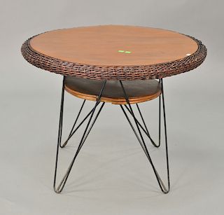 Decorative hairpin and wicker occasional table. ht. 23 1/2in., dp 30in.