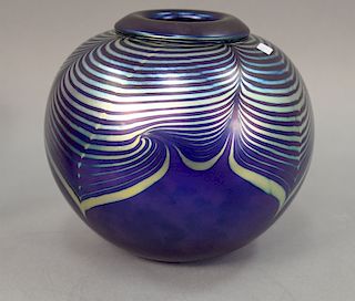 Blue art glass globular vase with iridescent pulled feather design, artist signed illegibly on bottom. ht. 9in.