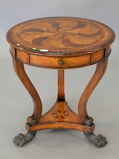 Theodore Alexander round inlaid occasional table on bronze paw feet. ht. 28 1/2in., dia. 27in.