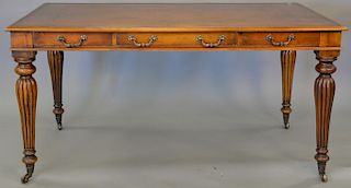 Mahogany leather top contemporary table with three drawers. ht. 30in., top: 34" x 60"