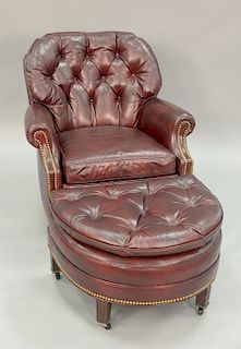 Two piece lot to include Hancock and Moore leather easy chair and ottoman.