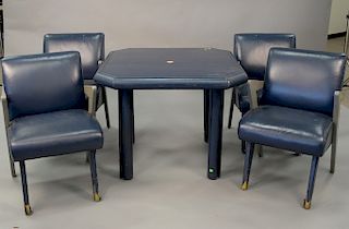 Five piece set to include four armchairs and card table in blue leather in the style of Paul Laszlo, 1980's (some losses to leather)...