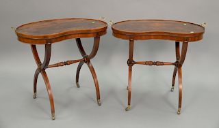 Pair of mahogany kidney shaped tables with brass handles. ht. 20in., top: 17" x 28"