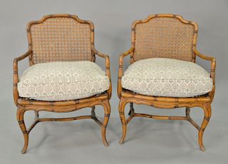 Pair of caned armchairs, having caned seat and back.