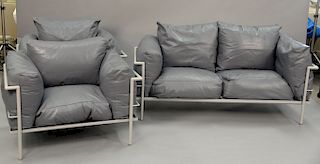 Three piece set to include two Carbussies leather lounge chairs, unmarked, and one settee. lg. 68in.