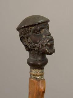 Cane with figural top bust of a bearded man with earrings. lg. 32 1/2in.