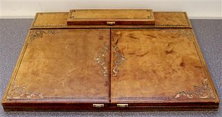 An Italian Gilt-Embossed Leather Travel Desk Top Width 19 3/4 inches.