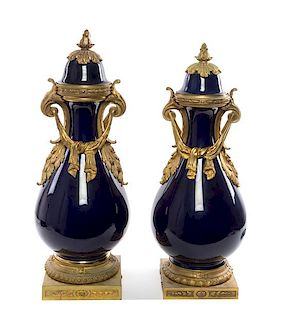 A Pair of Sevres Style Gilt Bronze Mounted Porcelain Vases Height of taller 29 inches.