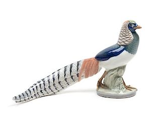 A Royal Copenhagen Porcelain Ornithological Figure Height 7 1/4 x width 12 inches.