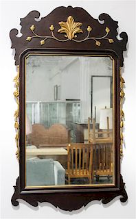 * A Chippendale Style Parcel Gilt Mirror Height 40 x width 23 1/2 inches.