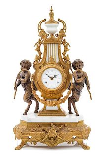 A Neoclassical Gilt and Patinated Metal Mantle Clock, Imperial Height 23 1/2 inches.