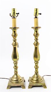 * A Pair of Brass Candlesticks Height overall 27 inches.