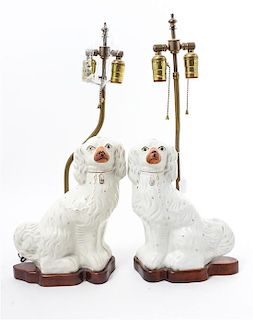 * A Pair of Staffordshire Spaniels Height 12 inches.