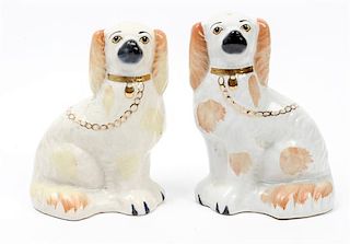 * A Pair of Staffordshire Spaniels Height 7 3/4 inches.