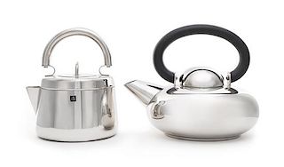 Two Stainless Steel Kettles Height of taller example 7 3/4 x width 9 1/2 inches.