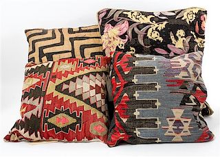 A Group of Four Pillows Largest 22 3/4 x 22 1/4 inches.