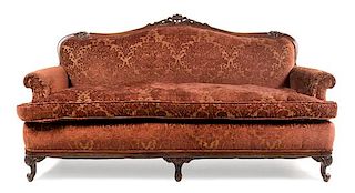 A Louis XV Style Walnut Sofa Height 37 x width 72 x depth 33 inches.
