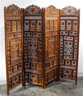 * An Indian Four Panel Carved Floor Screen Height 69 x width 17 3/4 inches (each panel).