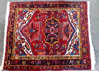* A Persian Wool Mat 2 feet 10 inches x 2 feet 6 inches.