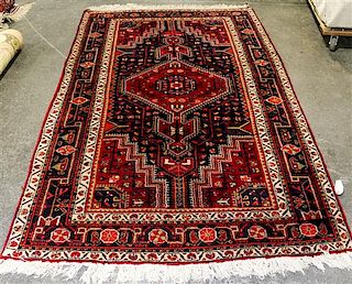 A Persian Wool Rug 8 feet 5 inches x 4 feet 11 inches.