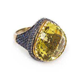 A Gilt Silver, Lemon Quartz and Sapphire Ring, 12.40 dwts.