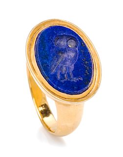 A 9 Karat Yellow Gold and Lapis Lazuli Intaglio Ring, British, 7.30 dwts.
