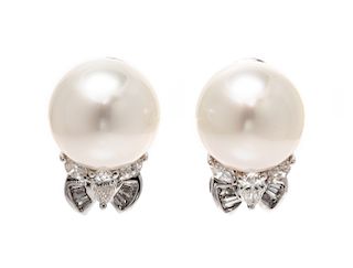 A Pair of 18 Karat White Gold, Cultured Pearl, and Diamond Earclips, 5.10 dwts.