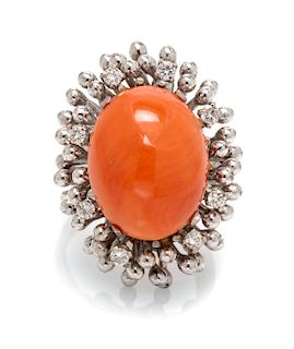 A 14 Karat White Gold, Coral and Diamond Ring 8.40 dwts.