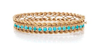 A 14 Karat Yellow Gold and Turquoise Bangle Bracelet, 16.60 dwts.