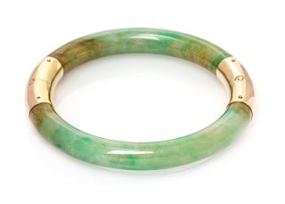 A 14 Karat Yellow Gold and Jade Bangle Bracelet, 19.65 dwts.