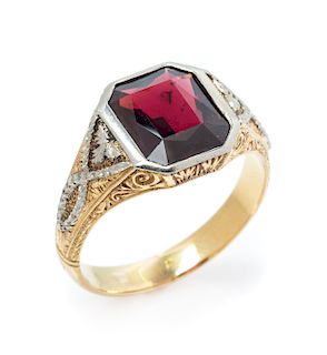 A Bicolor Gold and Garnet Ring, 7.10 dwts.
