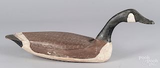 Carved and painted swimming Canada goose decoy