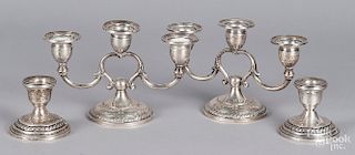 Two pairs of weighted sterling silver candlestick