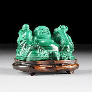 A CHINESE CARVED MALACHITE FIGURAL GROUP OF THE LAUGHING BUDDHA, ALSO KNOWN AS HOTEI, AND COMPANION YOUTHS, LATE 20TH CENTURY,