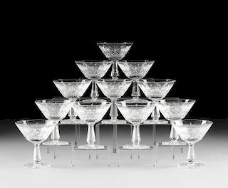 A SET OF TWELVE WATERFORD CUT CRYSTAL CHAMPAGNE/TALL SHERBET GLASSES IN THE "KENMARE" PATTERN, DESIGNED CIRCA 1968,